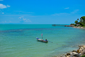 Long tail boat in the sea, Beautiful sea clear water, relaxing in your holiday at Khanom beach Nakhon si thammarat Thailand.