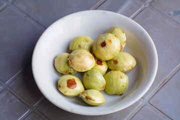 Archidendron pauciflorum, Known as Djenkol, Jengkol or Jering served in white bowl on the table