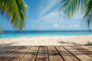 Fototapeta premium Wooden table with blurred bokeh light seascape and palm leaves at tropical beach background