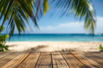 Fototapeta premium Wooden table with blurred bokeh light seascape and palm leaves at tropical beach background