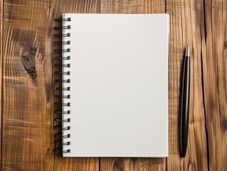 Blank page notebook with pen on wooden table.