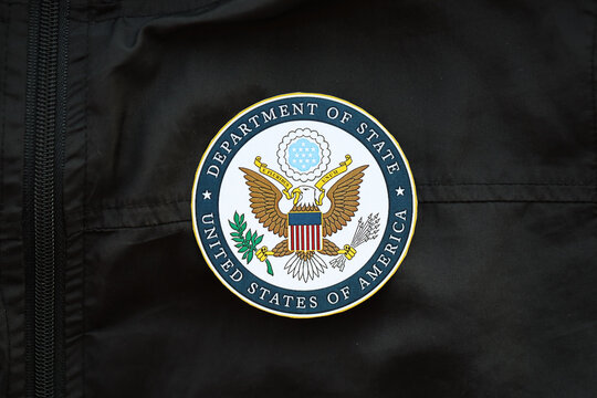 KYIV, UKRAINE - MARCH 9, 2024 US Department of State seal on black jacket uniform close up