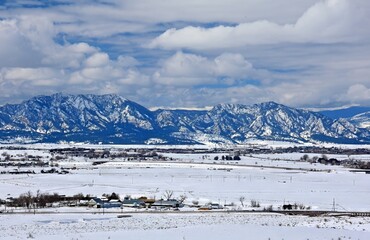 the  striking boulder flatirons and  snow -capped peaks of the front range of the colorado rocky...