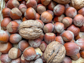 close up of hazelnuts and walnuts on the market