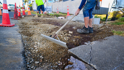 Road resurfacing. Workers repairing the road. Auckland.
