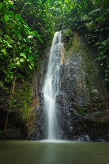 Fototapeta na wymiar Long exposure of Batu Putu waterfall in lampung, indonesia