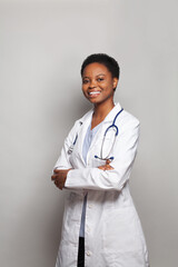 Naklejka na ściany i meble Successful doctor woman medical worker in lab coat on white background