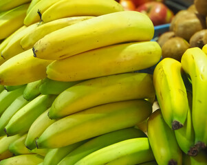 Group of unpeeled ripe bananas