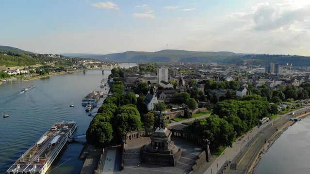 Deutsches Eck or German Corner headland in Koblenz, where the Mosel River joins the Rhine in Koblenz Germany during sunset, Drone aerial view