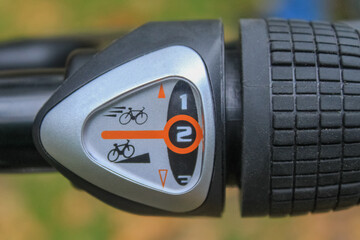 Close-up of an electric scooter's speed selector. The speed selector is usually located on the...