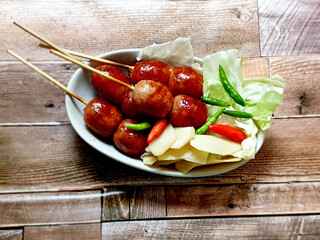 Thai northeastern sausage eat with cabbage, ginger, and chili, very delicious food in Thailand