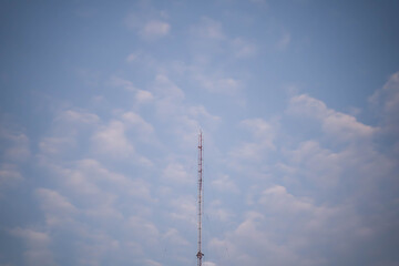 Transmission towers or cell phone towers on the morning sky background. Technology concepts in internet and mobile communication