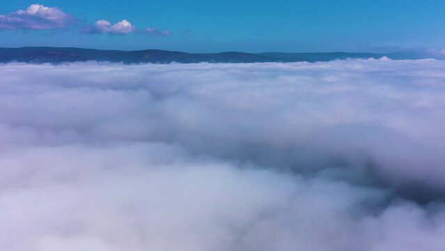 Aerial view of a beautiful fog over the sea 