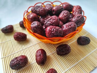 Dried grand jujube red dates, isolated on background.