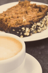 Fresh baked pastry made of zucchini and cup of white coffee. Delicious dessert
