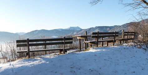 lookout place above lake tegernsee with benches, view to Hirschberg mountain