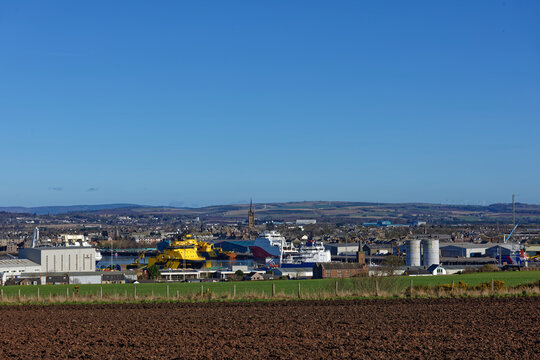 The bustling Port of Montrose backing on to Farmland on the southern side, with Offshore Supply Vessels moored up ready for loading operations.