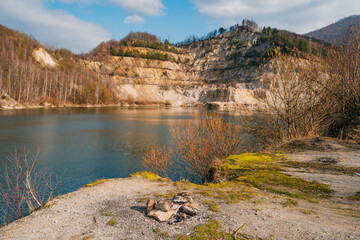 Fototapeta premium Inundated quarry, ideal for summer days of swimming. Natural phenomenon in Slovakia. Quarry or Sutovske lake. Spring atmospher
