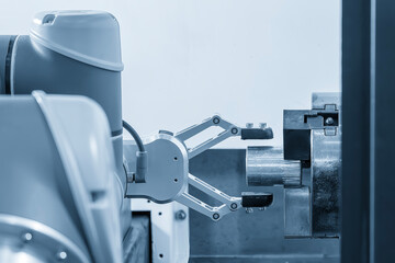 The high technology material handling process by automatic robotic system in turning process.