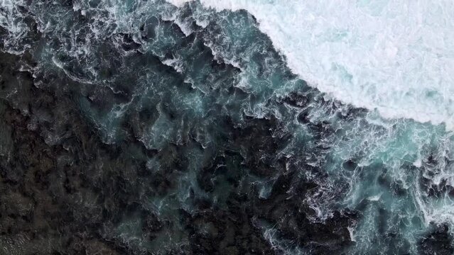 Aerial Drone View of Ocean Waves on Coastline Rocks