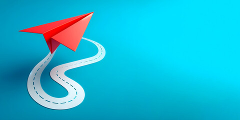 A red paper plane isolated on a blue background, banner with space for text