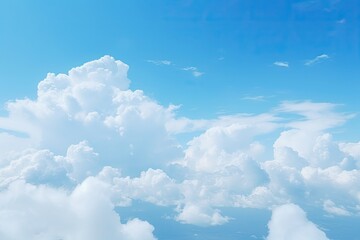 Naklejka na ściany i meble white fluffy clouds are in the blue sky