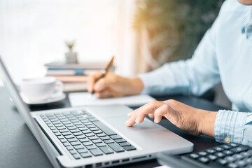 Businesswoman is deeply reviewing a financial report for a return on investment or investment risk...