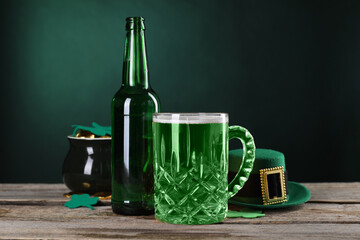 St. Patrick's day party. Green beer, leprechaun hat, pot of gold and decorative clover leaves on...