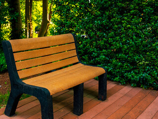 An empty bench on the garden deck