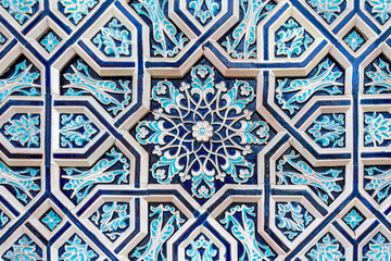 The traditional design pattern of Uzbekistan on the ceramic walls of a museum.