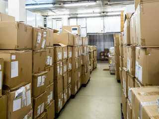 warehouse with cardboard boxes on pallets