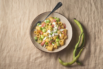 Sicilian traditional pasta with fave beans, green onions, pancetta, wild fennel and  ricotta salata  (salt ricotta). Poor cuisine, la cucina povera of Sicily.. Spring, Easter recipes, rustic style - 760525734