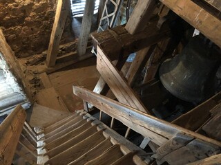 Wooden stairway around the bell