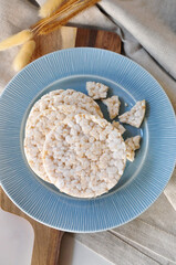 Top view of Healthy Snack Rice Cracker on Blue Plate