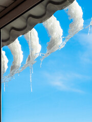 melting snowdrifts and icicles turned to window