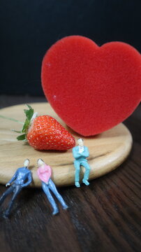 people with red heat and strawberry design for story and connotation concept