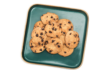 Group of chocolate chip cookies in a green plate top view isolated on white background clipping path