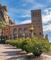 Santa Maria de Montserrat abbey in Monistrol, in a beautiful summer day, Catalonia, Spain - obrazy, fototapety, plakaty