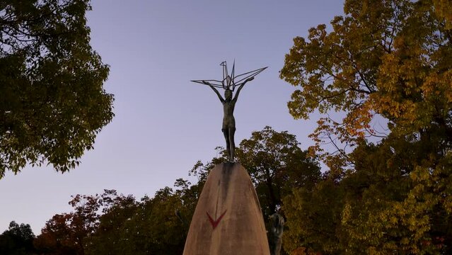 Hiroshima Children's Peace Monument Sadako Sasaki at sunset in Hiroshima Peace Memorial park in Japan. High quality 4k footage.