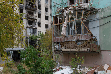 Fototapeta na wymiar Destroyed and abandoned residental building during war in Ukraine.