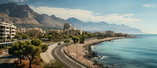 beautiful Albir town with main boulevard promenade, seaside beach and Mediterranean sea - obrazy, fototapety, plakaty