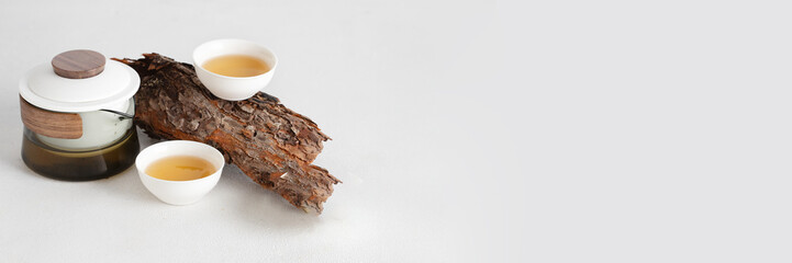 Oriental Tea concept, aesthetic set of teapot and cups on wooden podium at white background ,...