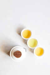 Flay lay composition, minimalist tea set with teapot and cups on white background, minimalist style