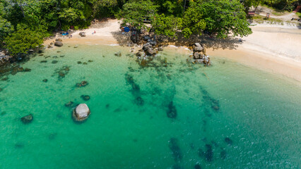 Aerial view of a small sandy tropical beach and shallow ocean. Small Sandy Beach at Lam Ru national...