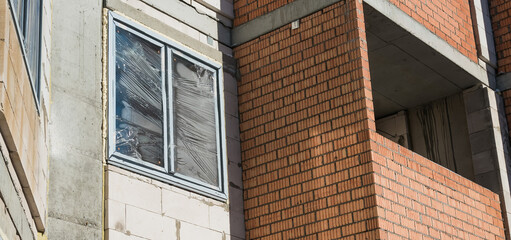 View of an apartment building under construction with balconies