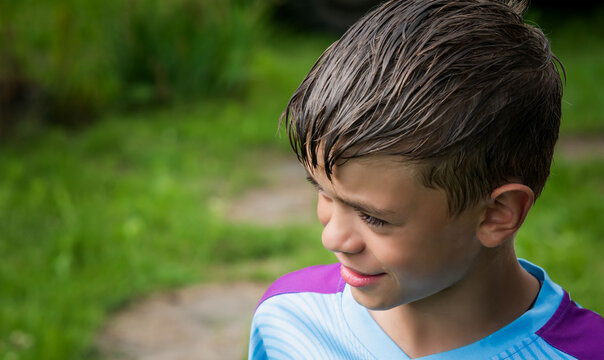 Portrait image of a little boy with a wet head