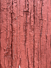 wooden background in crimson color with cracks
