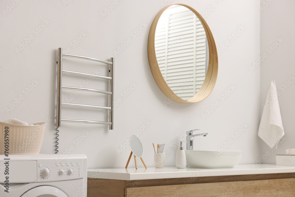 Canvas Prints Stylish bathroom interior with heated towel rail and washing machine