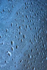 Water drops on the glass. Abstract background and texture for design.