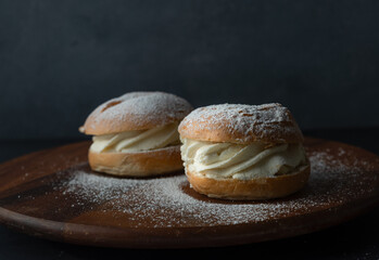 Traditional Swedish pastry. Semla or semlor, flavored with cardamom, filled with almond paste and...